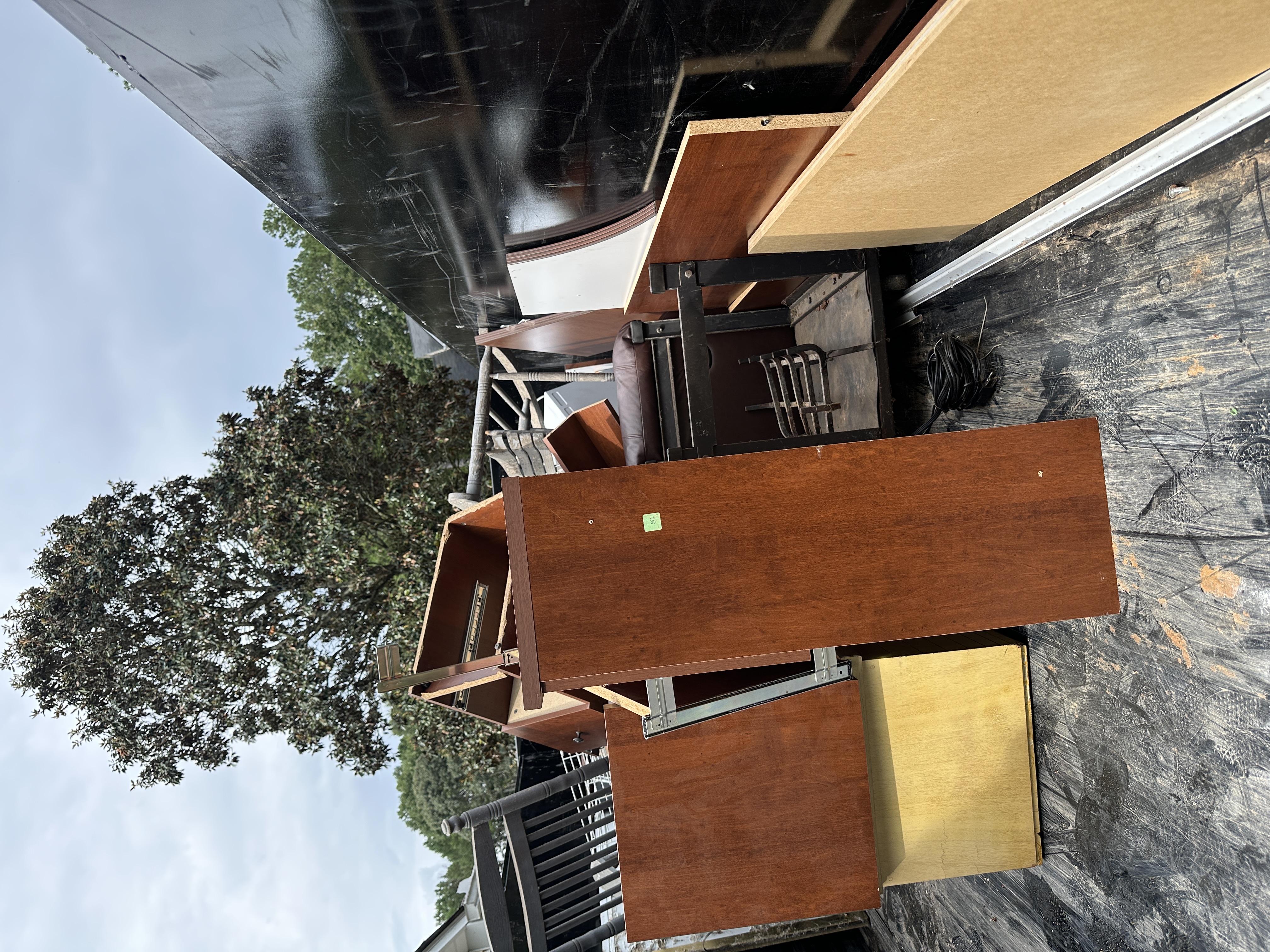 Trailer loaded with old cabinets and furniture