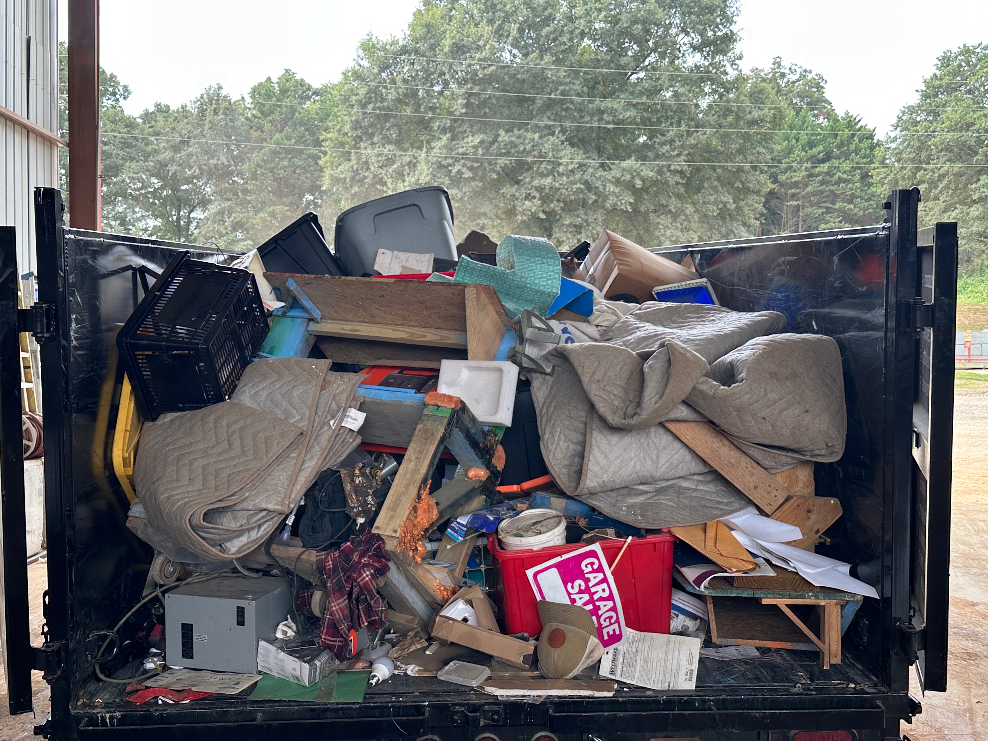 Trailer loaded with mixed household items
