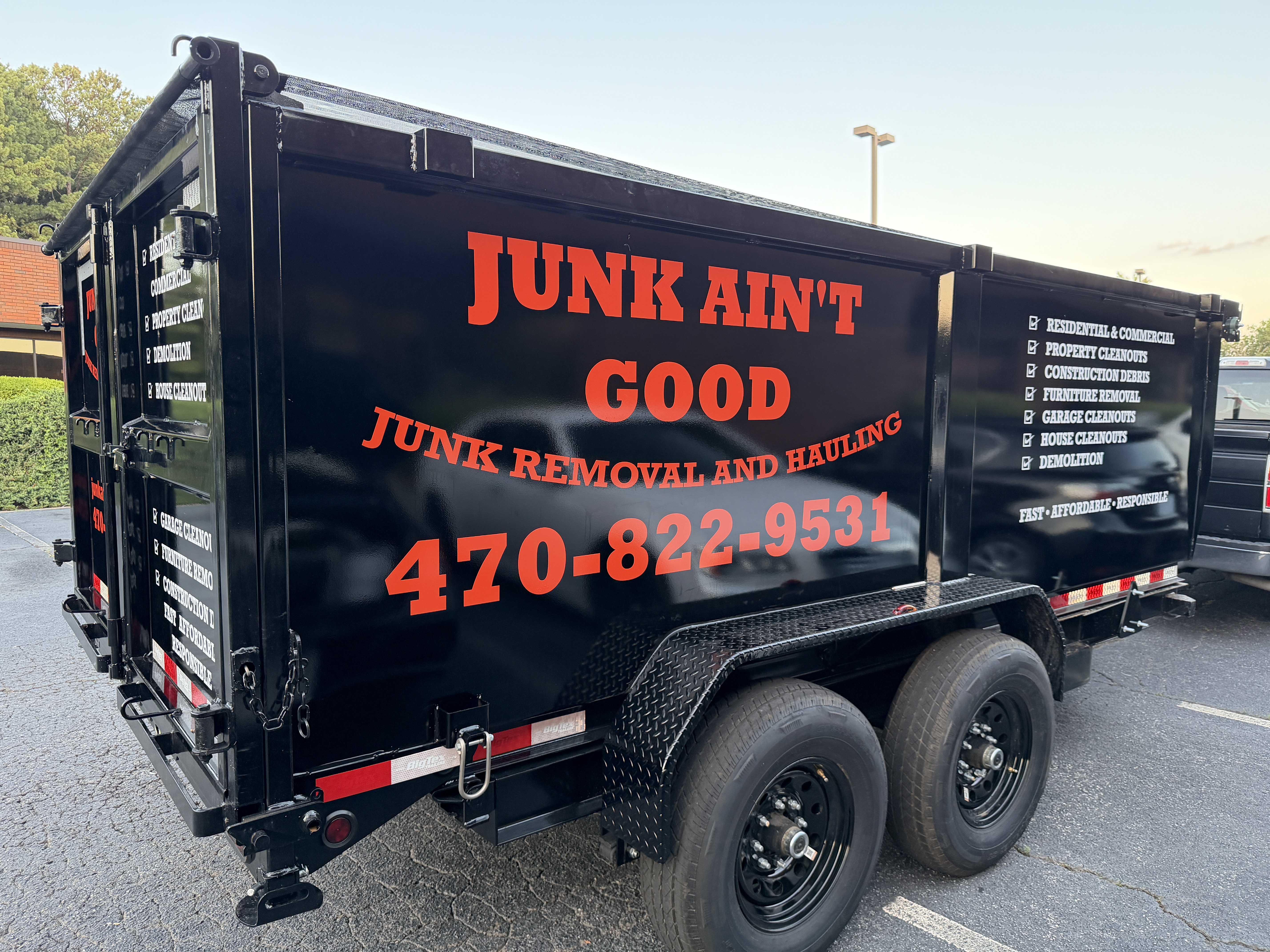 Junk Ain't Good branded trailer, junk removal and hauling in Gwinnett County GA